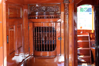 When we first saw the boat, we were drawn to the ornate woodwork, reminding us of a private rail car