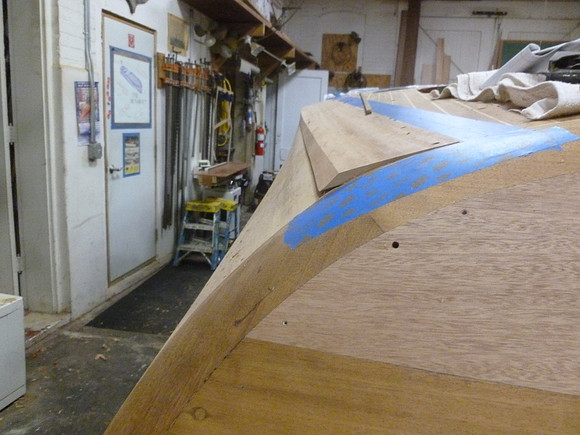 New covering board being fit, left of tape marks, also note new laminate on transom, from previous vacuum installation photo