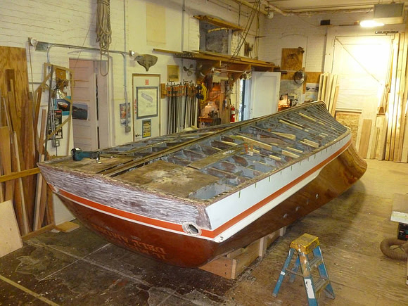 With the boat upside down, the real work can begin