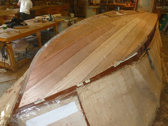 New, longitudinal mahogany planking installed